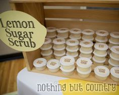 a wooden box filled with lemon sugar scrubs next to a sign that says nothing but country