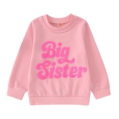 a pink sweatshirt with the words, big sister on it in sequins and letters