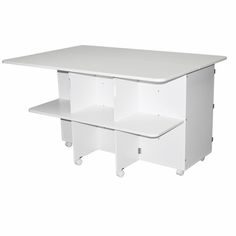 a white table with two shelves on each side