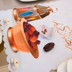 a table topped with lots of different types of food on top of white place mats