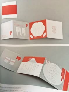 an open brochure with red and white designs on the front, inside and out