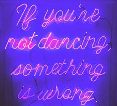 a neon sign that says if you're not dancing something is wrong