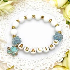 This adorable Cinderella inspired bracelet is perfect for your little princess! It makes an adorable gift, princess party favor, or Easter basket stuffer. Bracelet is made with 8mm white beads, separated with 4mm faux gold beads, your princess's name in gold letter beads, bookended with blue sparkle beads. The blue carriage charm is the perfect finishing touch! Charm and sparkle beads also available in white or pink! These variations will still have white and gold beads! Bracelets are approximat Princess Party Favor, Princess Bracelet, Costume Princess, Cinderella Princess, Princess Party Favors, Cinderella Costume, Blue Sparkle, Personalized Party Favors, Princess Cinderella