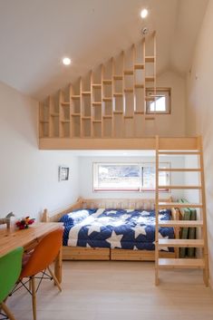 a loft bed sitting under a wooden staircase