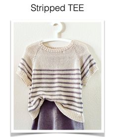 a sweater hanging on a wall with the words striped tee written below it and an image of