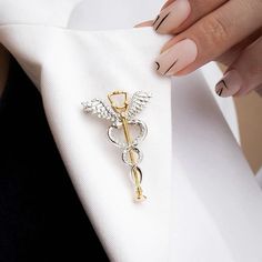 Find a lot more medical pins and nurse brooches in our Shop! https://www.etsy.com/shop/OrbitalEdge These pins are excellent thank you gift for doctors, medical students, nurses, and healthcare professionals. This caduceus brooch featuring a stethoscope is a stylish complement to everyday wear. The pin is available in 2 variants; gold and silver tones. This medical pin is made of plated stainless steel (not an enamel pin) an perfect gift for healthcare workers.  FREE SHIPPING: We offer free shipping on orders of 3 PINS OR MORE. All orders shipped from the USA. GIFT BOX: We also offer a 3D plastic gift/display box for an extra $2 that you can add to your orders. Contact us if you need custom packaging, additional instructions, or messages for bulk orders (3 or more units). MATERIAL: These me Resident Doctor, Doctor Jewelry, Medical Pins, Medical Quotes, Nurse Jewelry, Medical Wallpaper, Nursing Pins, Medical School Motivation, Medical Jewelry