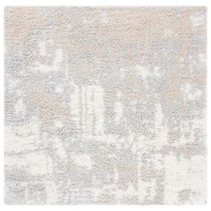 an area rug with white and gray colors