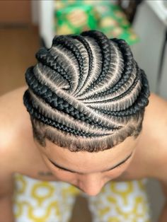 a man with braids on top of his head