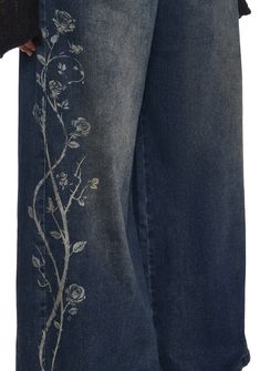 the jeans are decorated with flowers and vines