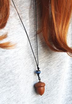 Handmade pendant  with natural acorn, which was picked right after it fall off of the oak tree. It was allowed to dry, cleaned and gently attached to the cap. Also, I added some colorful beads to give it a special touch. The pendant has a black thread chain to carry on your neck. The thread is 40 cm length (if you want to get a longer thread, please let me know and I will add an extra length). This forest necklace will always keep a piece of my touch. It will gently adorn your neck and hold warm wishes inside. It could be worn as a talisman to keep you safe, attract success and love; The acorn necklace can be a real treasure for all nature lovers; It is really cute, pretty little thing and I hope you will enjoy this talisman as much as I have had to create it ♥ DIMENTIONS & SPECIFICS: ▶MAT Peter Pan Jewelry, Brown Nature-inspired Pendant Necklace, Felted Acorn Necklace, Hollow Acorn Necklace, Fairy Acorn Necklace, Victorian Acorn Necklace, Thread Chains, Acorn Jewelry, Forest Necklace