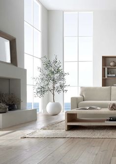 a modern living room with white walls and wood flooring is pictured in this image