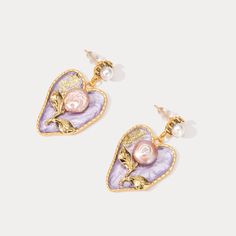 Lend a romantic note to your look with these lovely Pearl Lilac Earrings. Each heart-shaped bloom handcrafted from shimmering freshwater pearl hangs delicately. Rich amethyst tones infuse the vintage-inspired flowers with an air of femininity. Whether dressing casually or for special occasions, these sweet earrings impart a sense of calm glamour, capturing the soft essence of lilacs on a summer day. Their simple beauty makes a statement all its own. DETAILS Plating: 18K Gold  Materials: 18K Gold Constellation Earrings, Lilac Earrings, Everyday Wear Jewelry, Astrology Jewelry, Astrology Necklace, Sweet Earrings, Constellation Necklace, Evil Eye Earrings, Fine Silver Jewelry