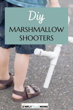 the legs and feet of a child on a bike with text overlay that reads diy marshmallow shooters