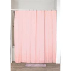 a pink shower curtain in a bathroom