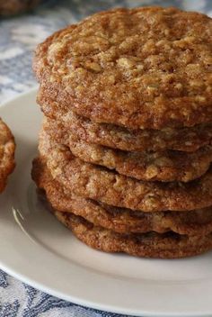 a stack of cookies sitting on top of a white plate