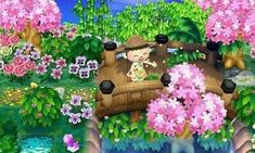 an animal crossing a bridge in the middle of flowers and trees, with a person on it