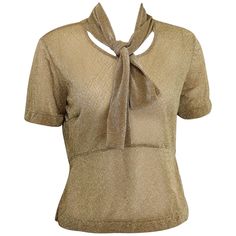 - Vintage 90s Dries Van Noten gold metallic cropped see through short sleeves blouse. Featuring same fabric attached to the neck. A nice see through top with glitter and shiny all over! - Made in Belgium. - Size M. - 54% Polyester , 46% Nylon. Chic Gold Short Sleeve Blouse, Metallic Fitted Short Sleeve Tops, Metallic Fitted Tops For Formal Occasions, Fitted Metallic Tops For Formal Occasions, Formal Fitted Metallic Tops, Gold Sheen Tops For Night Out, Fitted Short Sleeve Shimmer Tops, Fitted Shimmer Short Sleeve Tops, Fitted Vintage Gold Blouse