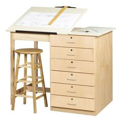 a wooden desk with drawers and stools next to a drawing board on top of it