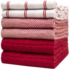 red and white towels stacked on top of each other