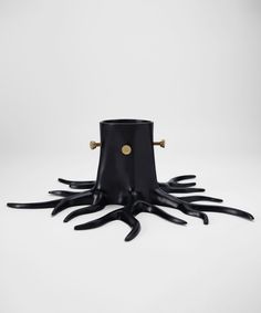 an octopus lamp is shown with its legs spread out and it's head turned to the side