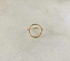 Enjoy this statement piece that will be made to order just for you! Available in gold filled, sterling silver and 14k gold. The band is 1.3mm Open circle is 1.3mm thick and approx. 15mm in diameter. Modern Open Circle Jewelry With Ring Detail, Fine Jewelry In 14k Gold Circle Shape, Everyday Brass Open Ring Jewelry, Everyday Brass Open Ring, Minimalist 14k Gold Dome Ring Tarnish Resistant, Adjustable Minimalist Dome Ring, Minimalist Tarnish Resistant Round Band Jewelry, Dainty Yellow Gold Brass Rings, Everyday Yellow Gold Circular Jewelry