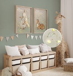 a baby's room with stuffed animals on the wall and pictures hanging above it