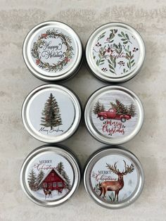 four tins with christmas designs on them