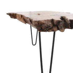 a wooden table with black hairpinks on it's legs and a piece of wood that has been cut in half