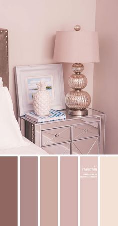 a bedroom with pink walls and silver furniture