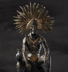 a statue of a man with an elaborate headdress sitting on his knees and holding two monkeys