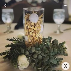 a vase filled with flowers sitting on top of a table