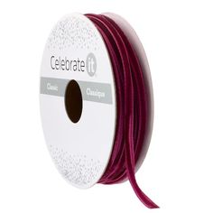 a spool of red leather cord with the words celebrate in white lettering on it