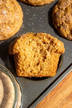 several muffins in a muffin tin on a table