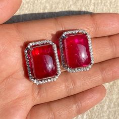 Ruby Diamond Earrings features doublet stone surrounded by CZ diamonds. Perfect for any special occasions. These Statement studs will surely elevate your whole look. Perfect for bride gift or gift for mom. *𝐏𝐑𝐎𝐃𝐔𝐂𝐓 𝐃𝐄𝐓𝐀𝐈𝐋* * 𝐌𝐚𝐭𝐞𝐫𝐢𝐚𝐥: Brass * 𝐏𝐥𝐚𝐭𝐢𝐧𝐠: White Rhodium Plated * 𝐒𝐭𝐨𝐧𝐞: AAA-quality CZ Diamond & Ruby. 𝐕𝐢𝐬𝐢𝐭 𝐎𝐮𝐫 𝐅𝐀𝐐𝐬 𝐟𝐨𝐫 𝐒𝐡𝐢𝐩𝐩𝐢𝐧𝐠 𝐏𝐨𝐥𝐢𝐜𝐢𝐞𝐬 𝐚𝐧𝐝 𝐂𝐚𝐫𝐞 𝐈𝐧𝐬𝐭𝐫𝐮𝐜𝐭𝐢𝐨𝐧 *𝐃𝐈𝐒𝐂𝐋𝐀𝐈𝐌𝐄𝐑* * Product color may slightly vary due to photographic lighting sources or your screen settings. * Stone color may vary slightly due to variations in natural stones. *𝐒𝐈𝐌𝐈𝐋𝐀𝐑 𝐃𝐄𝐒𝐈𝐆𝐍* https://www.etsy.com/listing/1756908147/ https://www.etsy.com/listing/1750398948/ Ruby Diamond Earrings, Jewelry Luxury, Red Diamond, Ruby Earrings, Bride Gift, Ruby Diamond, Red Ruby, Large Earrings, Red Stone