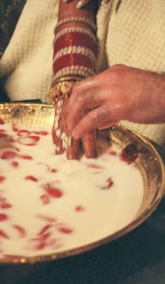 a close up of a person holding a plate with food on it