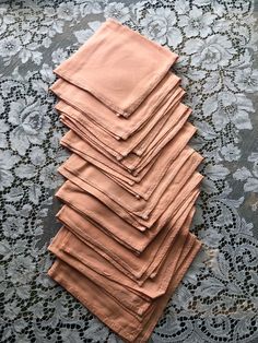 a stack of pink napkins sitting on top of a table