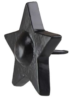 a black metal object with a star on it