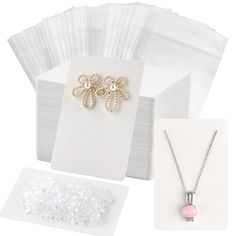 PRICES MAY VARY. Great Valuable Earring Display Kit: come with 120 pieces white earring cards, 120 self-sealing bags and 200 earring backs which are perfect for displaying and storing necklaces, earrings, bracelets, etc. Quality and Environmental Protection Material: made of high quality thick card paper, durable and sturdy, not easily deformed, friendly to environment, nice texture and easy to use. Human-friendly Design and Packing: 2 oblique line slots convenient for you to display your neckla Necklace Display Cards, Necklace Jewelry Display, Kraft Paper Tags, Jewelry Display Cards, Diy Jewelry Display, Homemade Ornaments, Necklace Display, Earrings And Necklace, Earring Holder