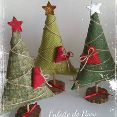 three small christmas trees with red and green decorations