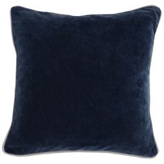 a dark blue velvet pillow on a white background