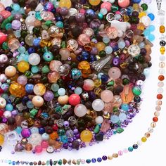 there are many different beads on the table