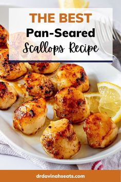 the best pan - seared scallops recipe on a white plate with lemon wedges