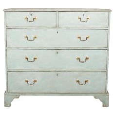 an old white dresser with gold handles and knobs on the bottom drawer, against a white background