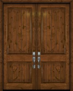 two wooden doors with metal handles on each side and wood paneling around the sides