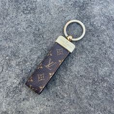 a keychain that is laying on the ground