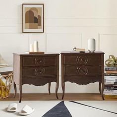 two wooden nightstands sitting next to each other on top of a white carpeted floor