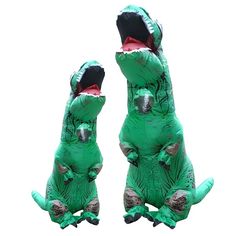 two inflatable alligators with their mouths open, one is green and the other is black