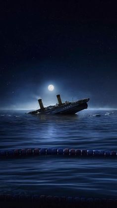 a large boat floating on top of the ocean at night