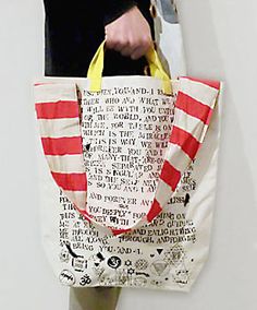 a person holding a bag with writing on it and a knife in the other hand