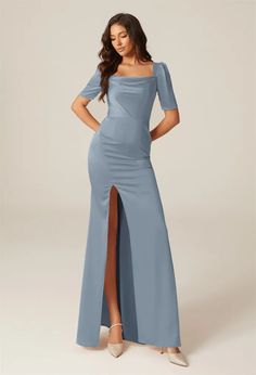 a woman wearing a blue dress with a slit in the side